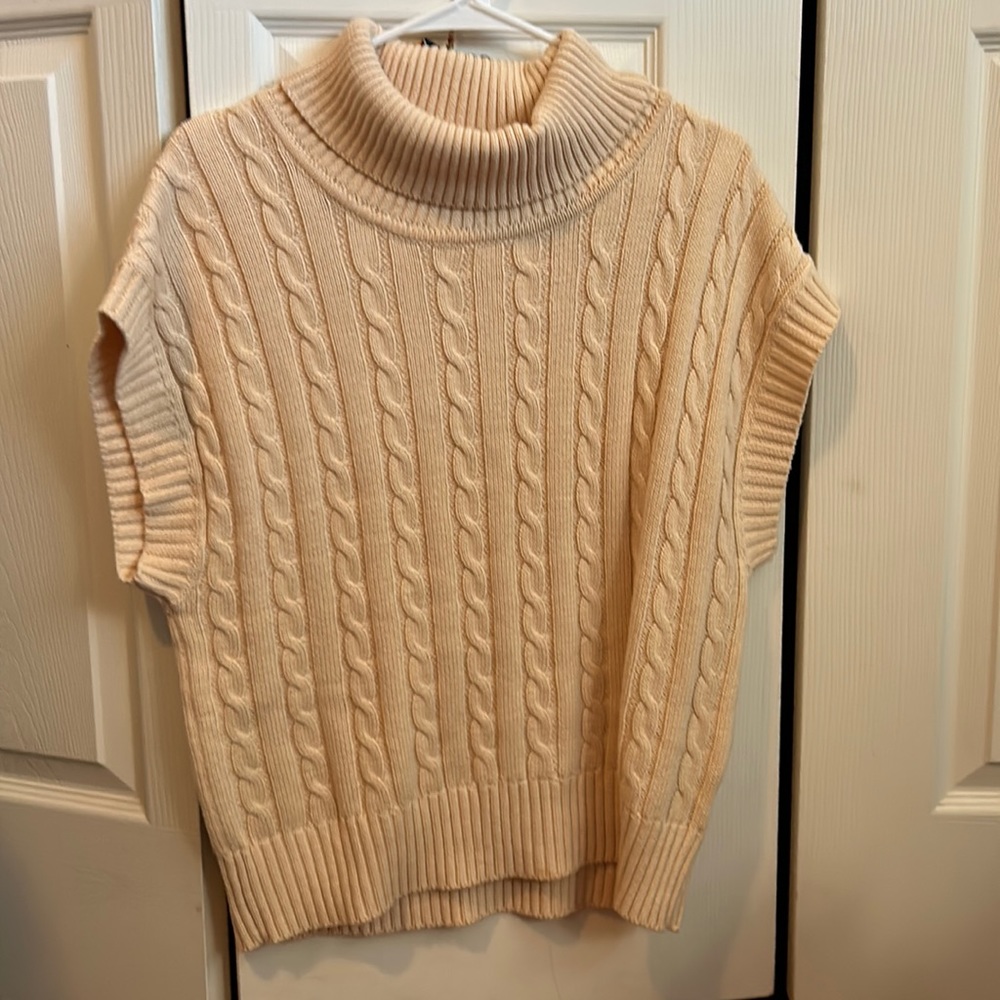 Cream color cable knit sweater . Worn once.